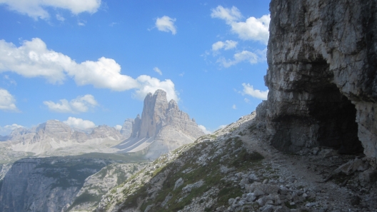 World War I trail on Monte Piano with Tre Cime di Lavaredo in the distance. Cortina, Italy.
